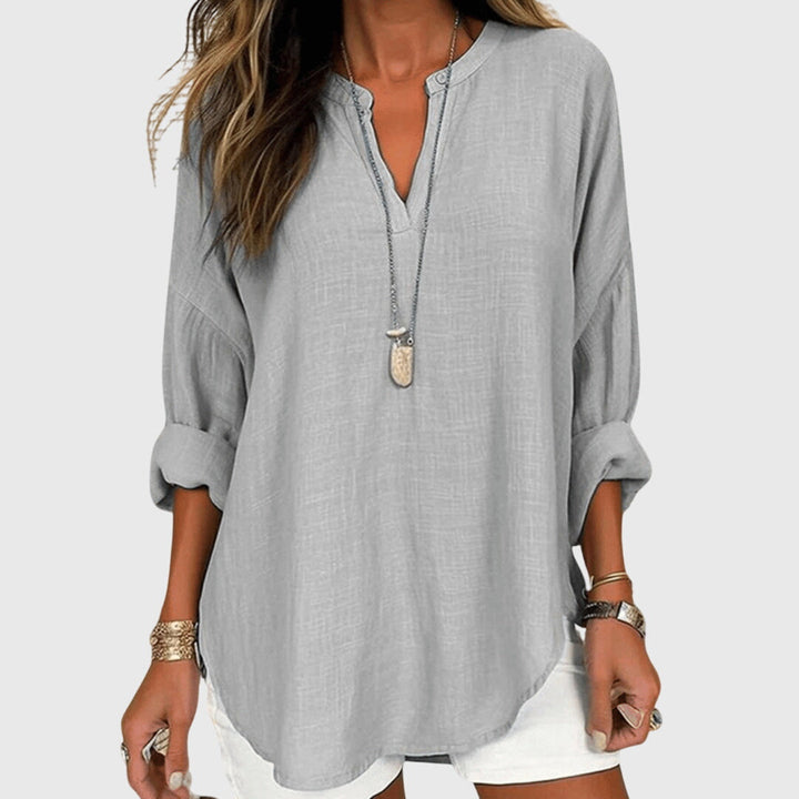 Lightweight women's flowy long sleeve beach shirt, an elegant & comfortable summer top for any occasion.