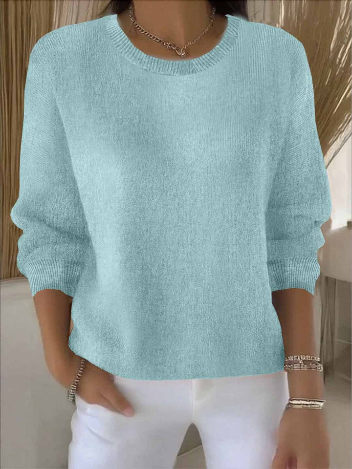 Effortless women's flowy sweater. Comfortable casual top, perfect for autumn coziness.
