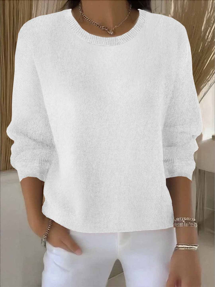 Versatile women's flowy sweater, ideal for chic layering & everyday casual outfits.