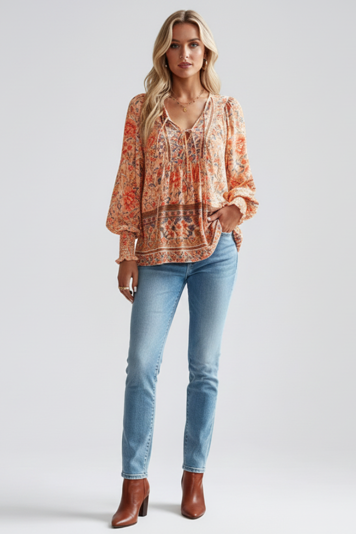 Lightweight women's flowy floral blouse with long sleeves. Relaxed fit V-neck top for elegant summer fashion.