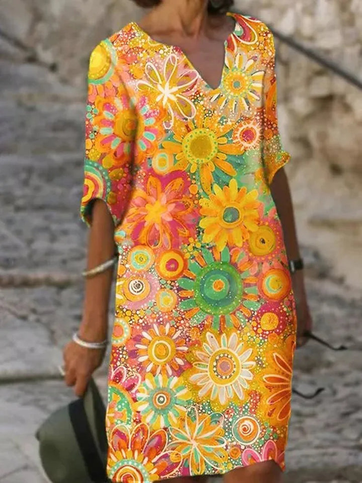 Women's flowy floral print sleeveless summer midi dress, perfect for casual elegance or vacation style.
