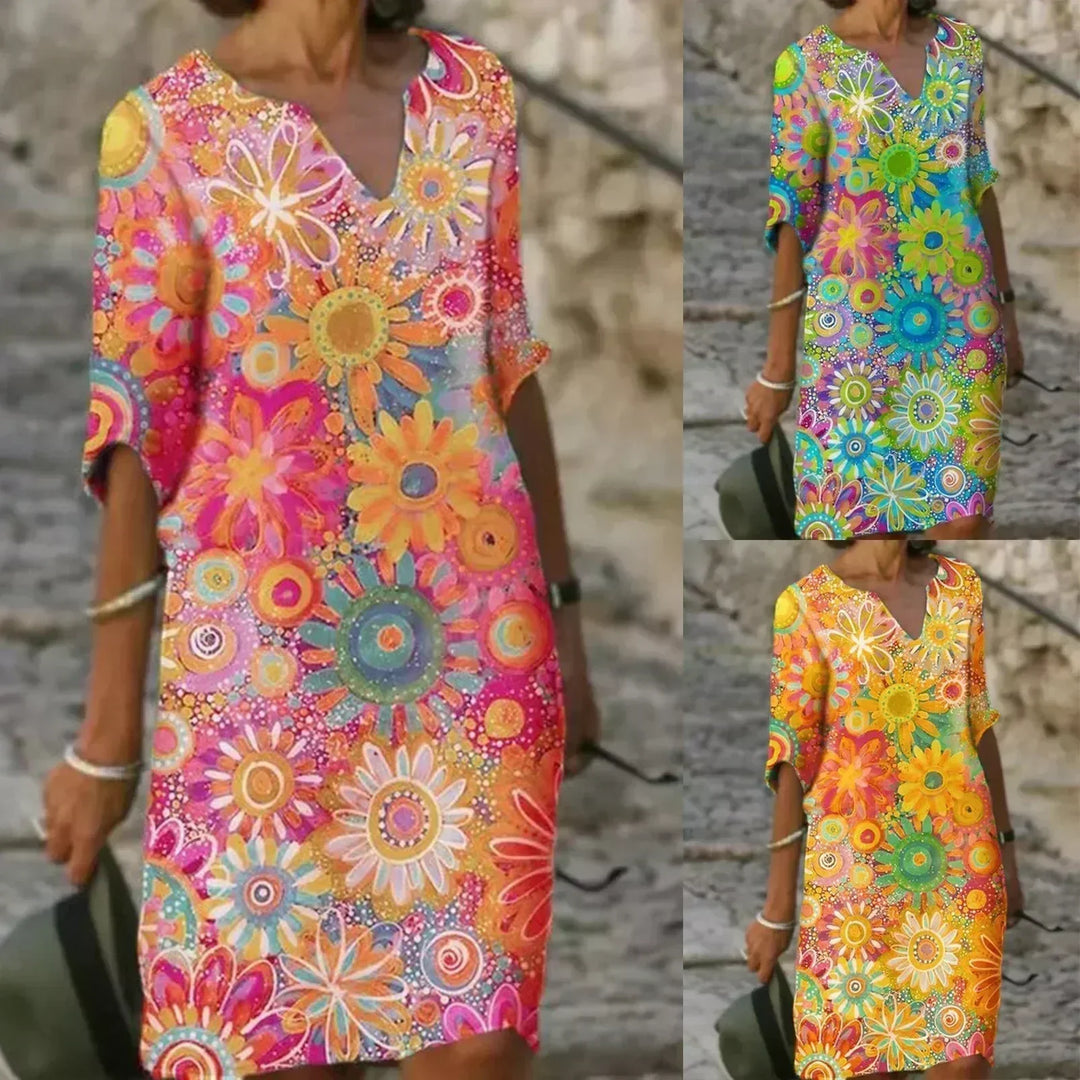Model wearing a women's flowy floral print sleeveless summer midi dress, perfect for a sunny day.