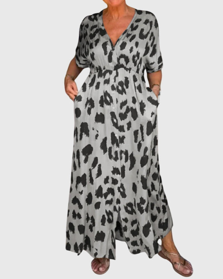 Women's stylish leopard print maxi dress featuring a V-neck, elastic waist, and button-front detail.