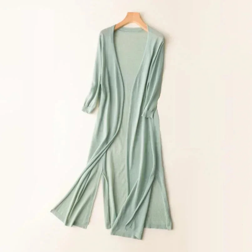 Elegant women's long cardigan featuring side slits & open front. Ideal for casual or dressy spring outfits.