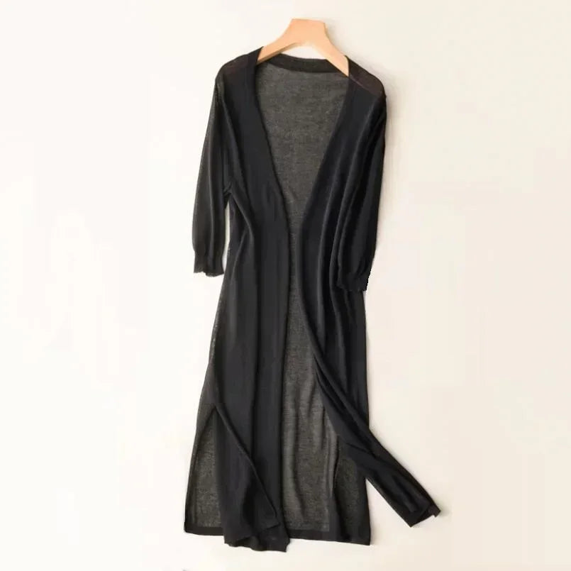 Lightweight women's flowy cardigan with three-quarter sleeves & side slits. Versatile spring/summer outerwear.