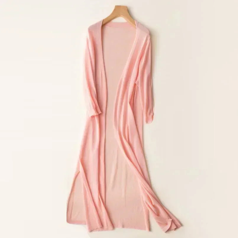 Casual women's long cardigan, open front with chic side slits. Essential layering piece for summer fashion.