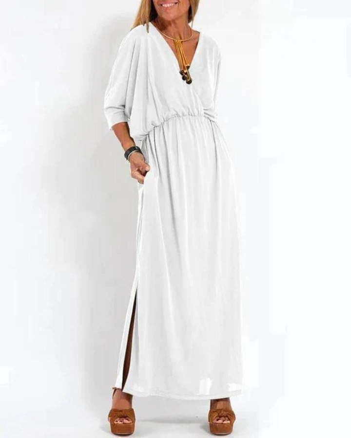 Elegant women's sleeveless midi dress featuring a flowy a-line design & adjustable straps. Ideal summer style.