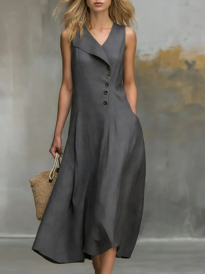 Sleeveless flowy midi dress for women, featuring a comfortable relaxed fit and stylish asymmetrical button detail.
