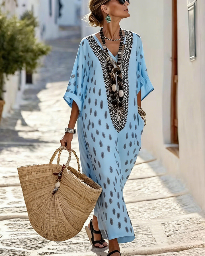 Elegant women's polka dot maxi kaftan dress with V-neck embroidery, ideal for resort wear & casual summer.