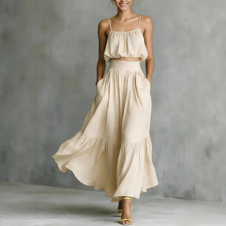Boho two-piece women's clothing set with ruffle maxi skirt and crop top. Ideal for summer vacation.