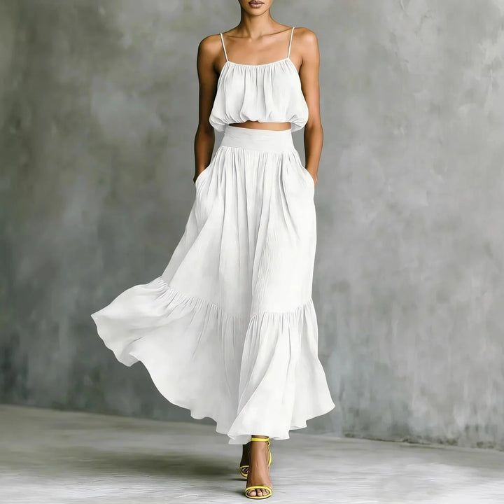 Stylish women's summer fashion set: flowy ruffle maxi skirt & matching spaghetti strap crop top.