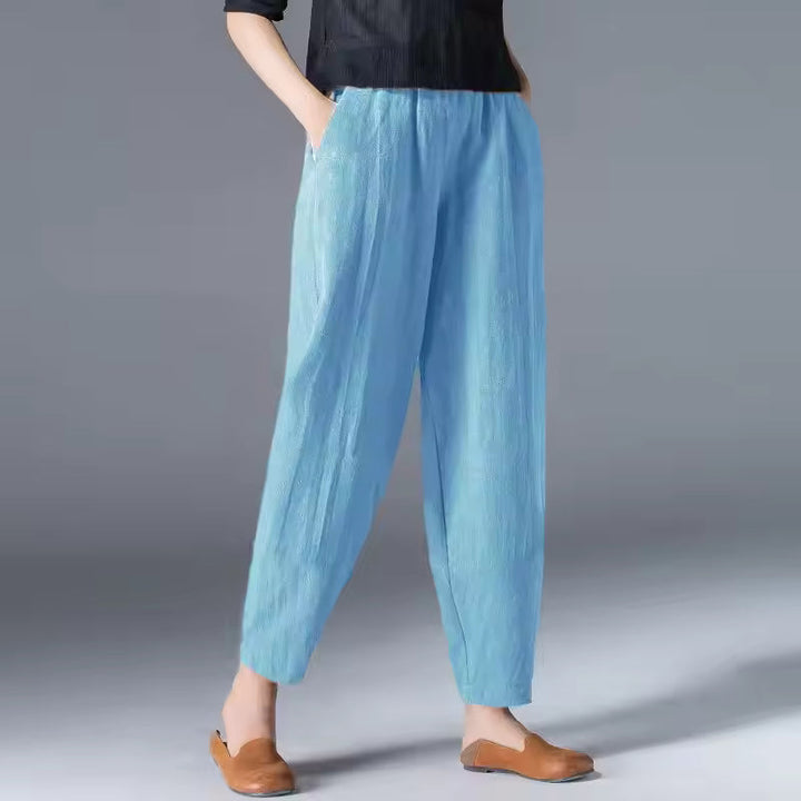 Close-up of lightweight, breathable fabric on women's flowy summer trousers. Ideal comfortable pants for hot climates.