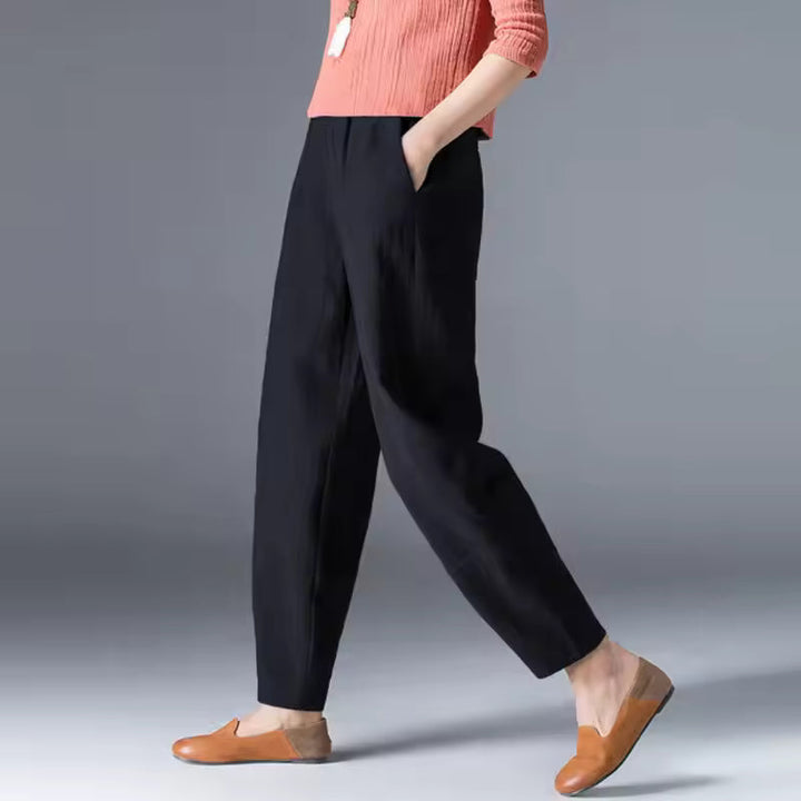 Back view of women's comfortable flowy summer trousers. Ankle length, relaxed fit, breathable fashion for everyday.