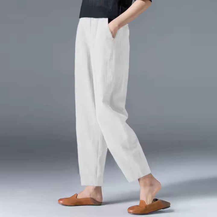 Woman in stylish, breathable flowy summer trousers. Versatile casual pants for women's fashion, perfect for summer.