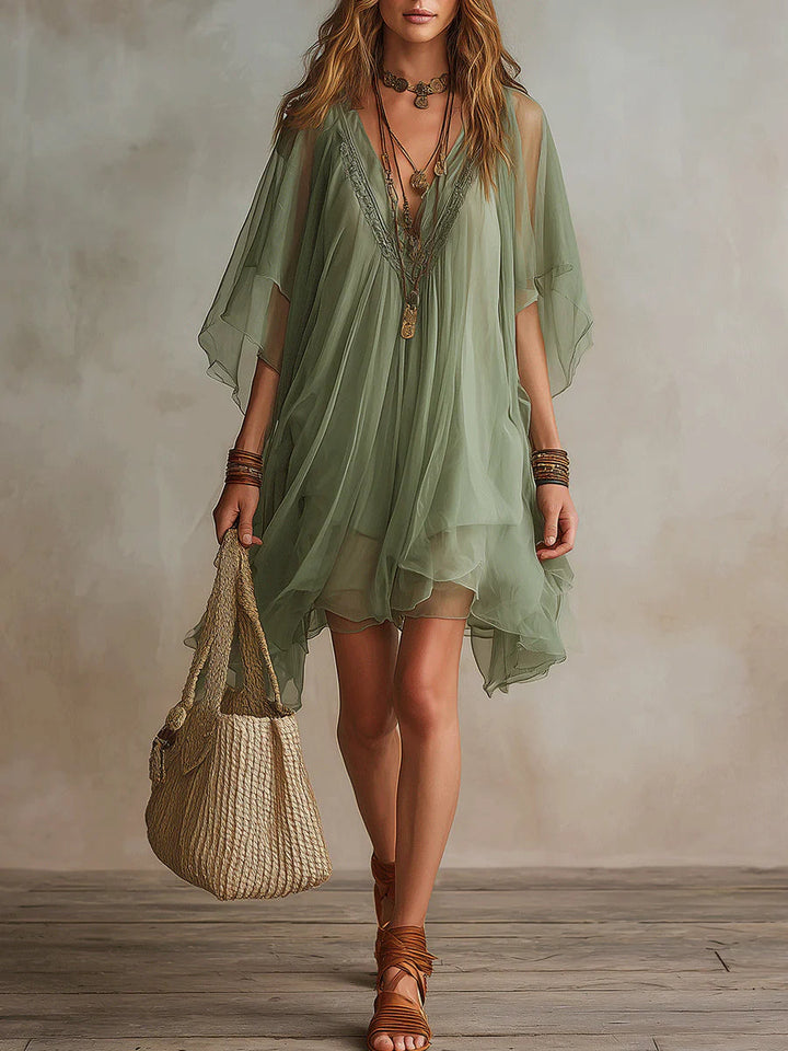 Women's flowy V-neck layered mini dress in a vibrant green, perfect for summer casual or beach style.
