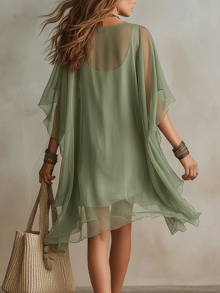 Versatile green V-neck layered mini dress for women, suitable as a casual summer dress, beachwear, or party outfit.