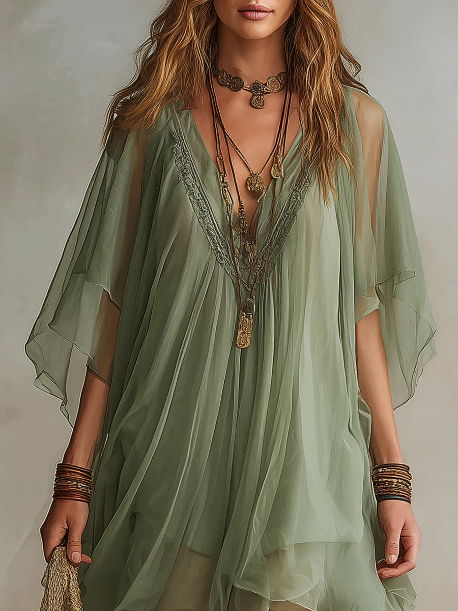 Chic green women's V-neck mini dress with elegant layered design, a perfect flowy summer dress for casual outings.