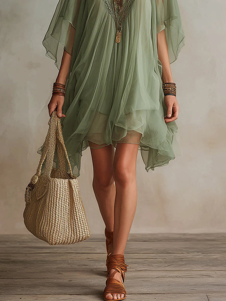 Effortless women's flowy V-neck layered mini dress, a relaxed fit green summer dress for ultimate comfort & style.