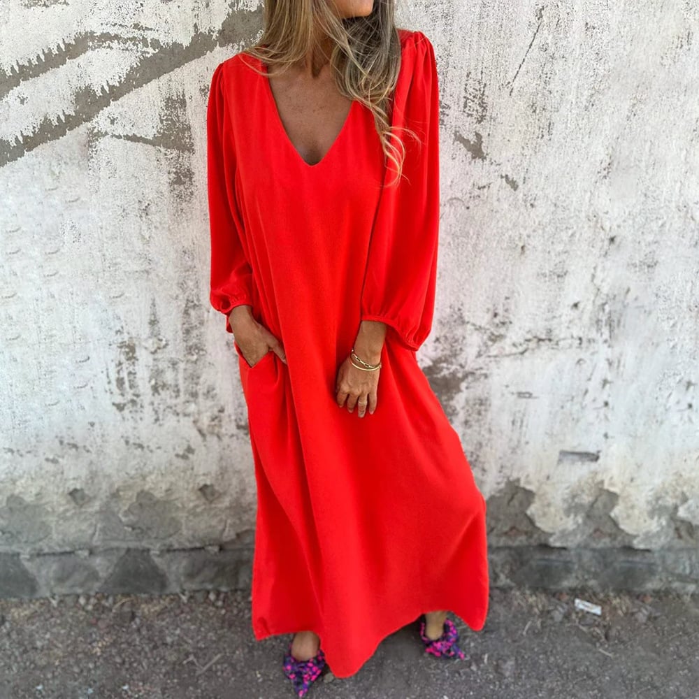 Elegant V-neck maxi dress for women, featuring a comfortable flowy design & practical side pockets.