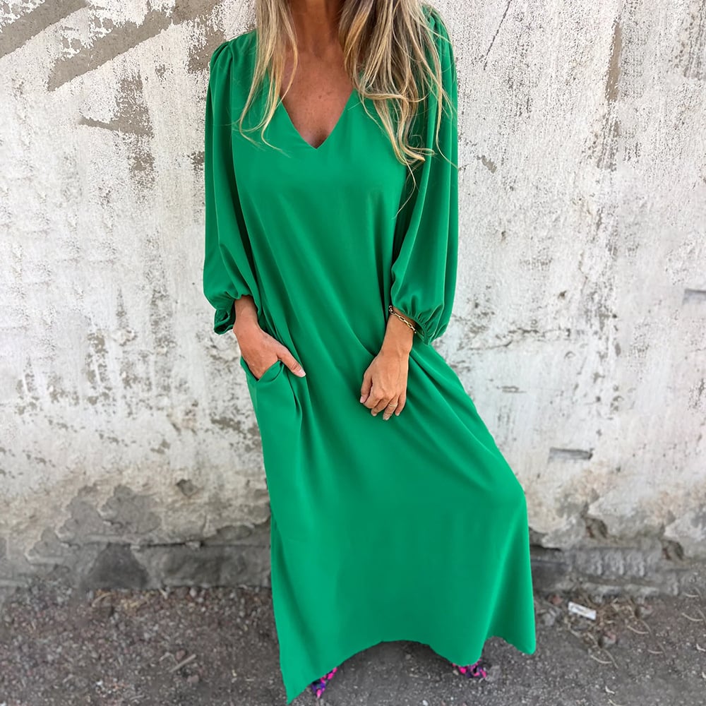 Summer-ready women's maxi dress. Relaxed fit, V-neck, balloon sleeves, & essential pockets for daily wear.
