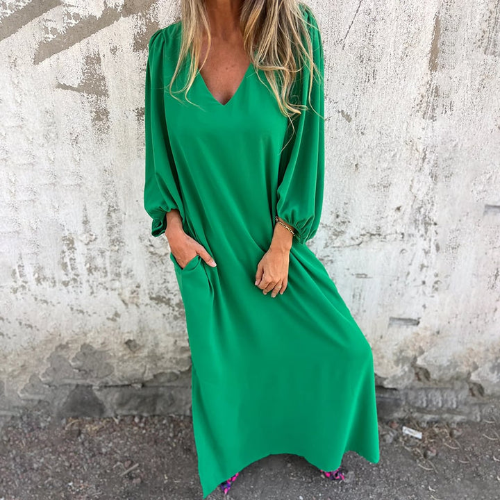 Summer-ready women's maxi dress. Relaxed fit, V-neck, balloon sleeves, & essential pockets for daily wear.