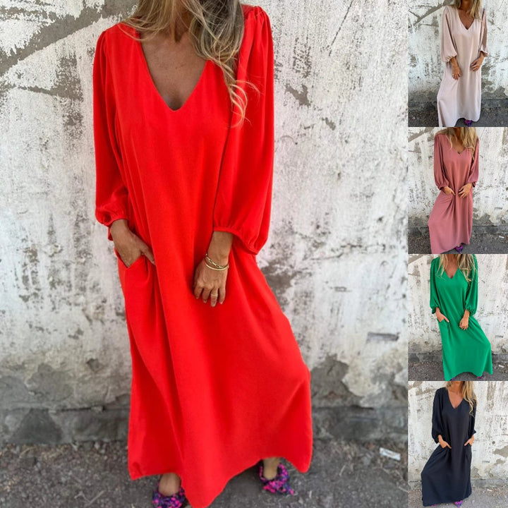 Close-up of the elegant balloon sleeves & comfortable V-neck on a women's flowy maxi dress.