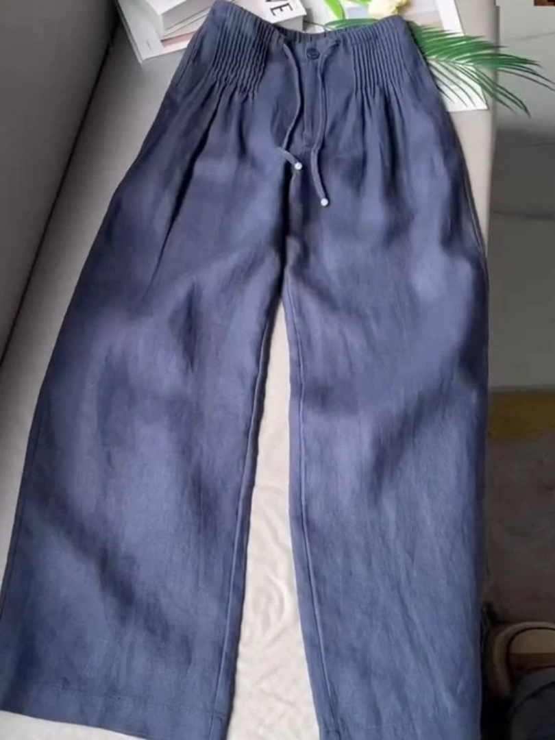 Women's flowy wide-leg trousers with comfortable elastic waist, perfect for casual summer fashion.