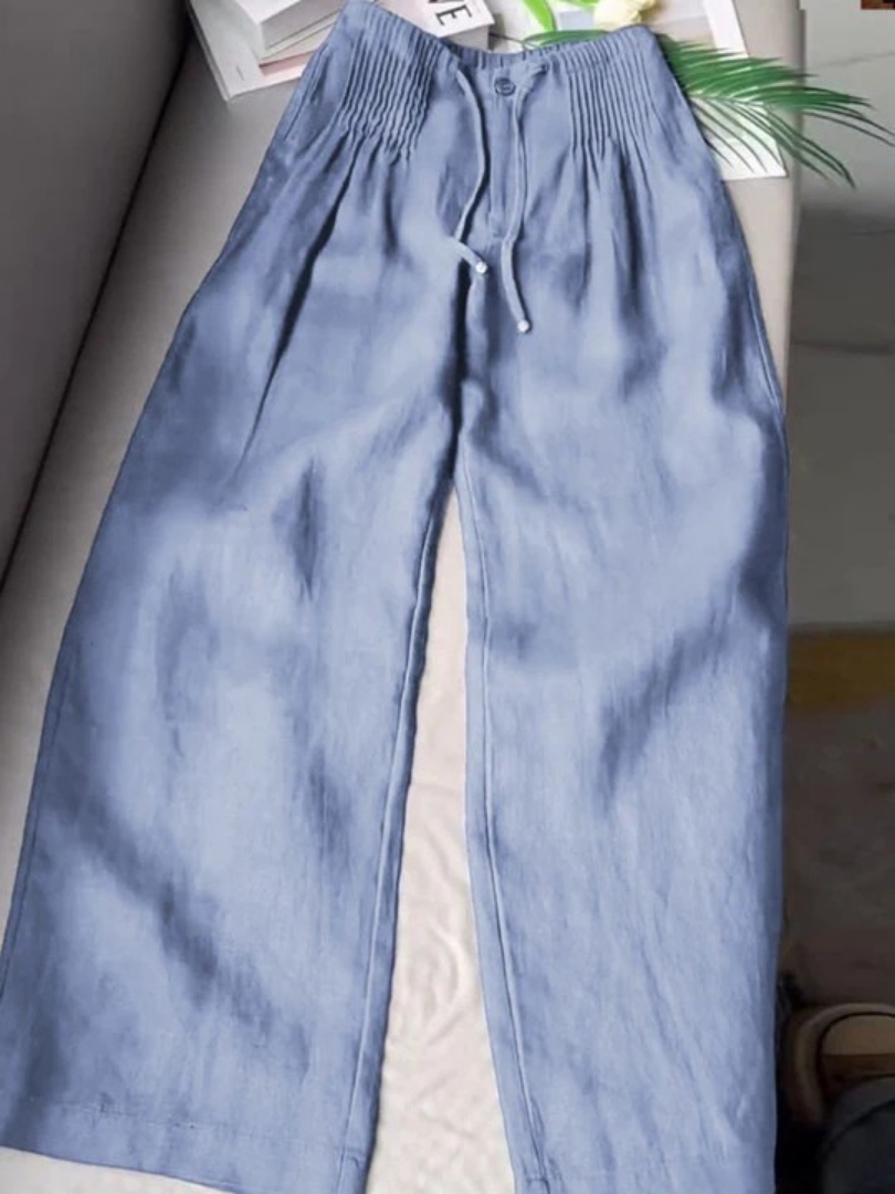 Relaxed fit wide-leg women's pull-on pants featuring an elastic waist for ultimate comfort.