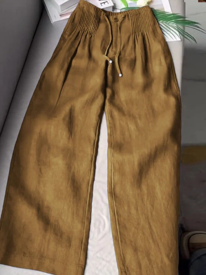 Chic and versatile flowy wide-leg women's pants, ideal for everyday wear and summer style.