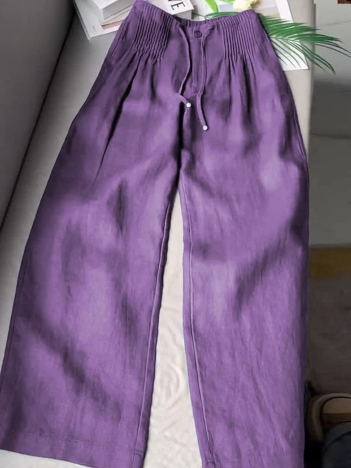 Lightweight flowy wide-leg trousers for women, designed with an elastic waist for casual comfort.