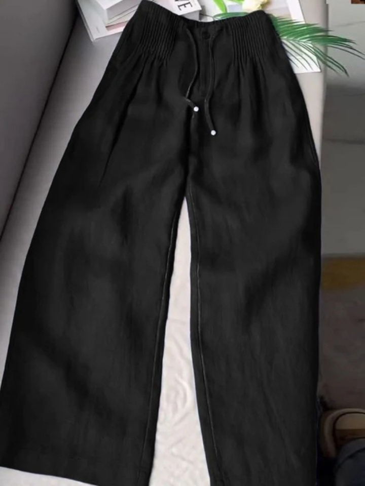 Soft, flowy wide-leg women's pants with an elastic waist, great for comfortable summer outfits.