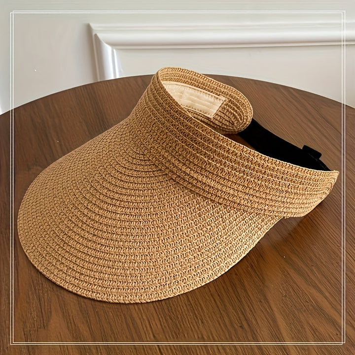 White women's foldable wide brim sun visor for UV protection, ideal for beach, travel & summer.