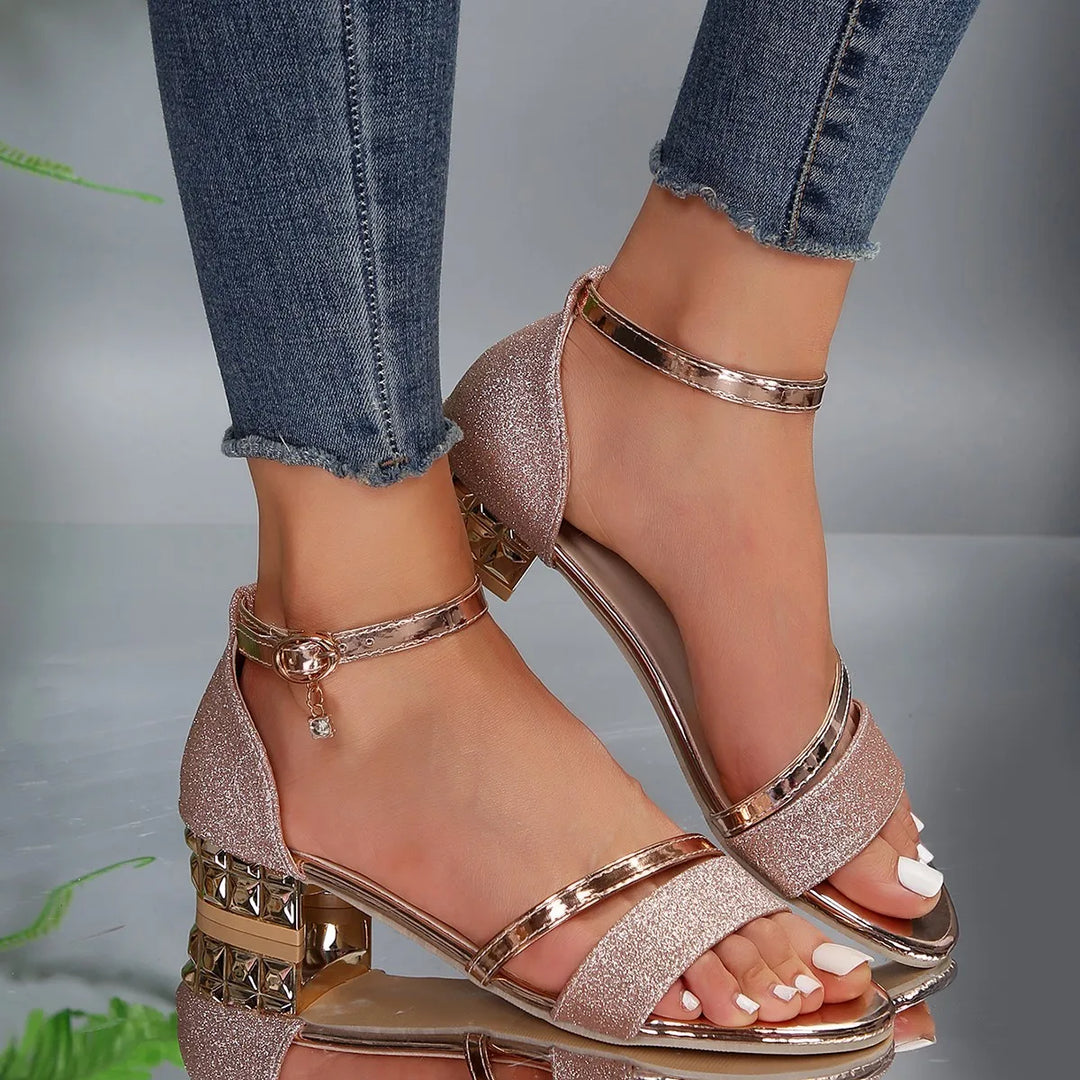 Fashion-forward Freya ankle strap sandals, featuring a stable block heel for all-day elegance.
