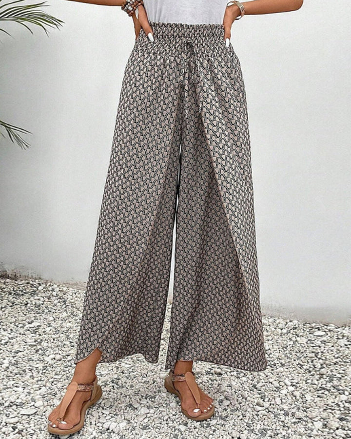 Relaxed fit wide-leg trousers for women, comfortable & fashionable. Striking geometric patterned casual pants.