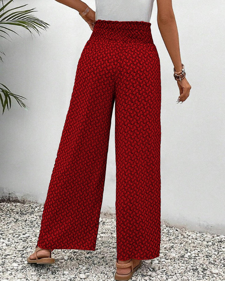 Close-up of the intricate geometric print on women's stylish wide-leg trousers, relaxed fit & elegant.