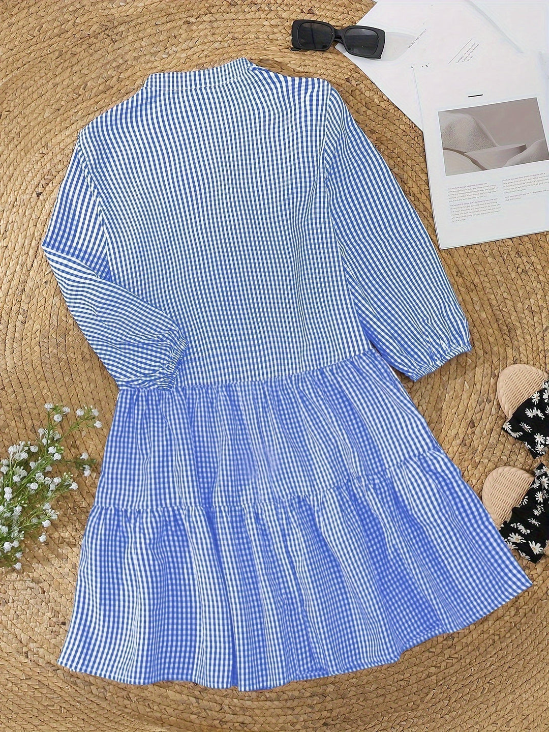 Fashionable women's gingham check button dress with tiered ruffles & puff sleeves, comfortable summer style.