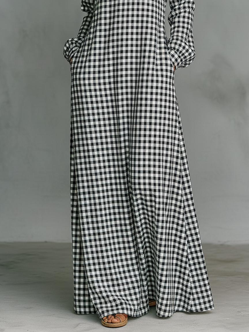 Elegant women's gingham maxi dress with V-neck & long sleeves. Perfect for casual spring/summer style. Timeless comfort.