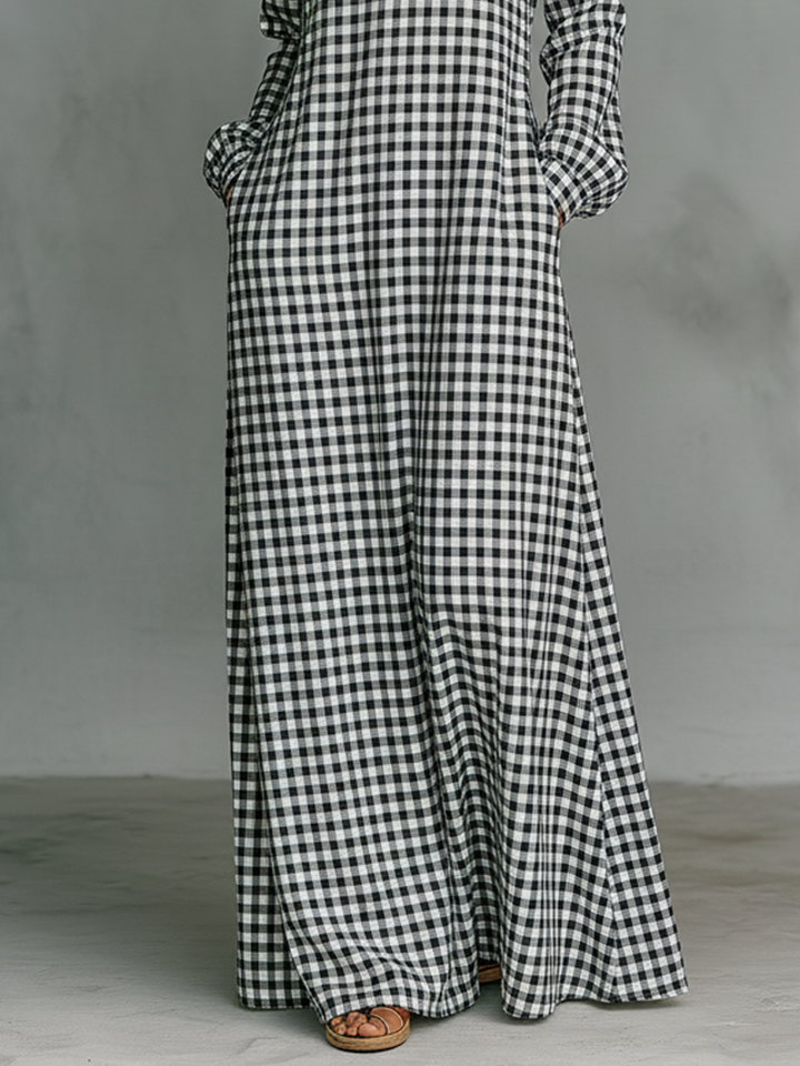 Elegant women's gingham maxi dress with V-neck & long sleeves. Perfect for casual spring/summer style. Timeless comfort.