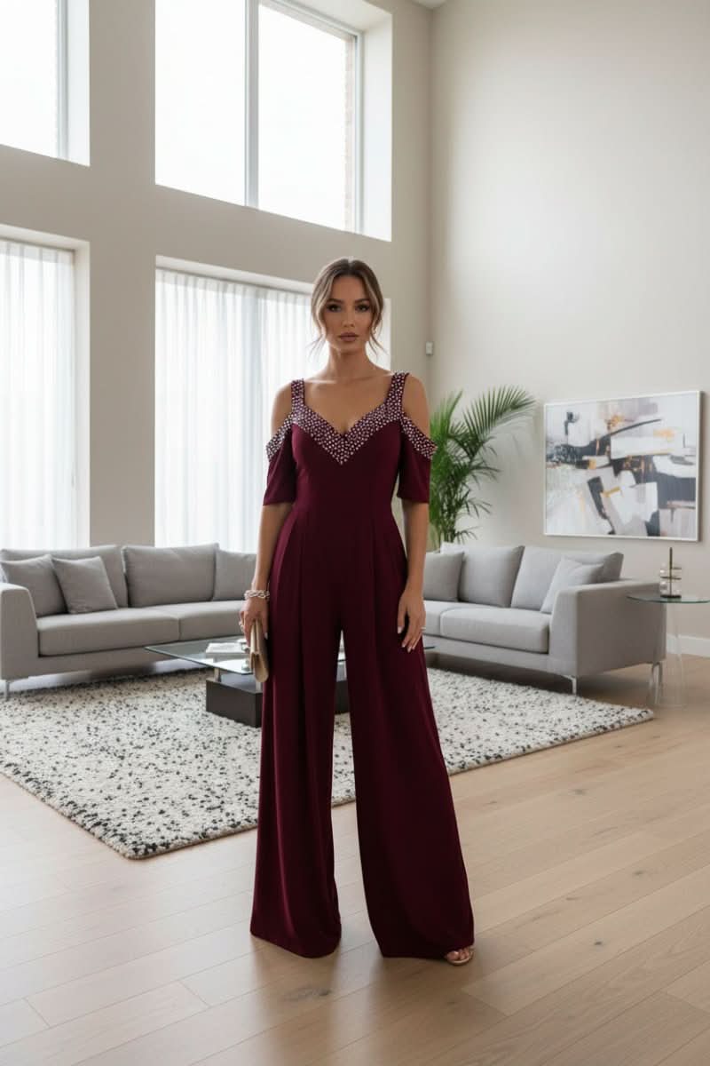 Sparkling women's rhinestone jumpsuit, featuring a flattering fit for sophisticated party wear & evening glamour.