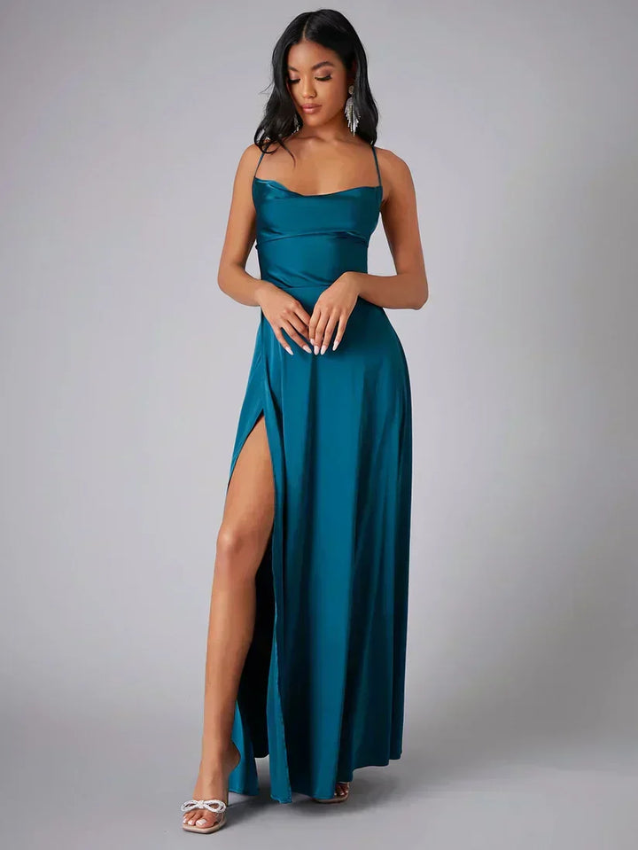 Striking women's formal maxi dress showcasing a stylish high slit and alluring open back design.
