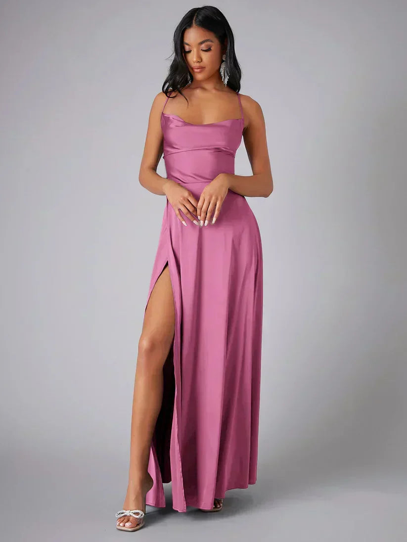 Black women's glamorous maxi evening gown with a dramatic high slit and open back for parties.