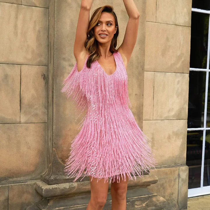 Celebration-ready women's sequin fringe mini dress with tiered details, great for dancing.
