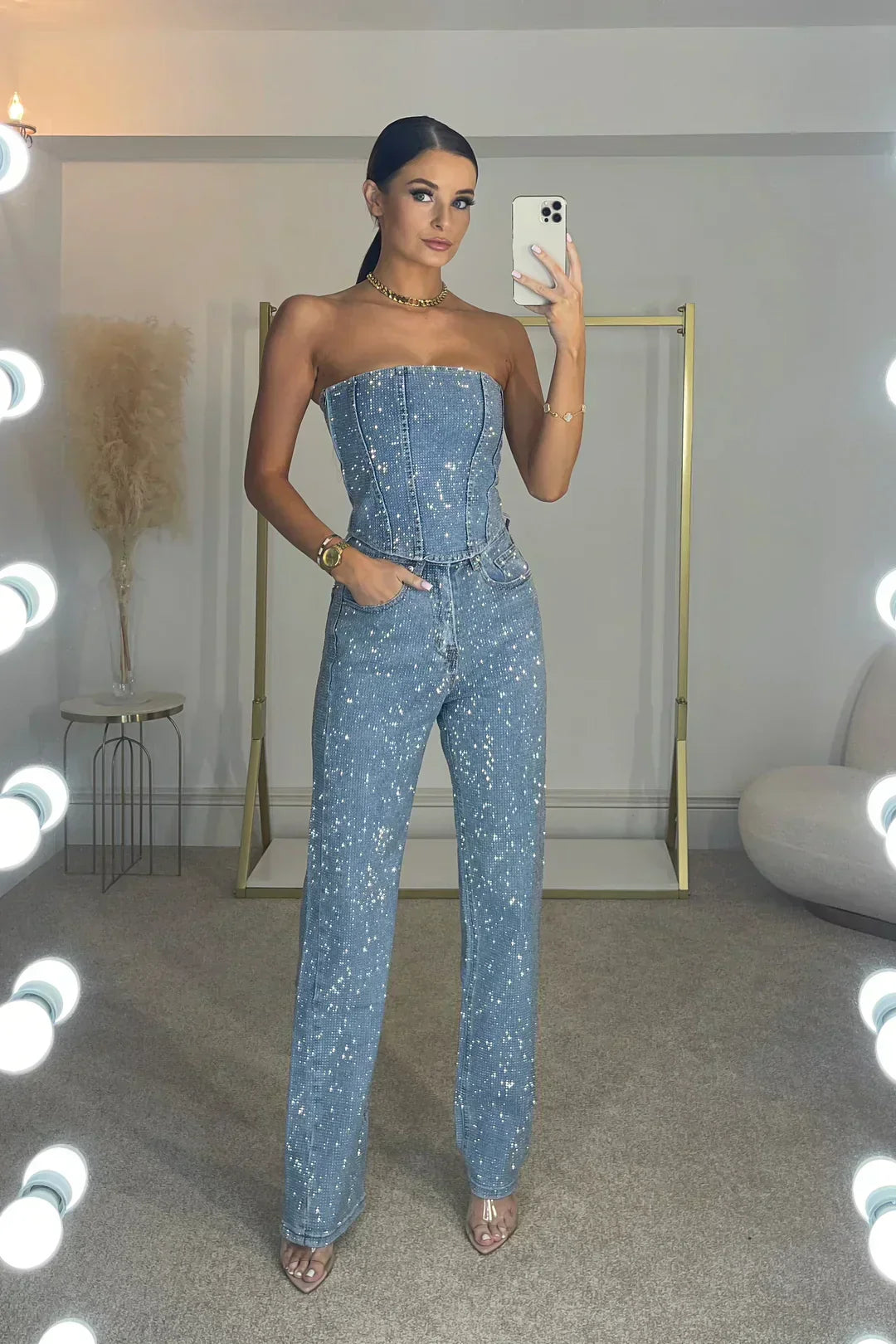 Complete women's glitter set: elegant top & comfortable high-waist jeans, ready for any party.
