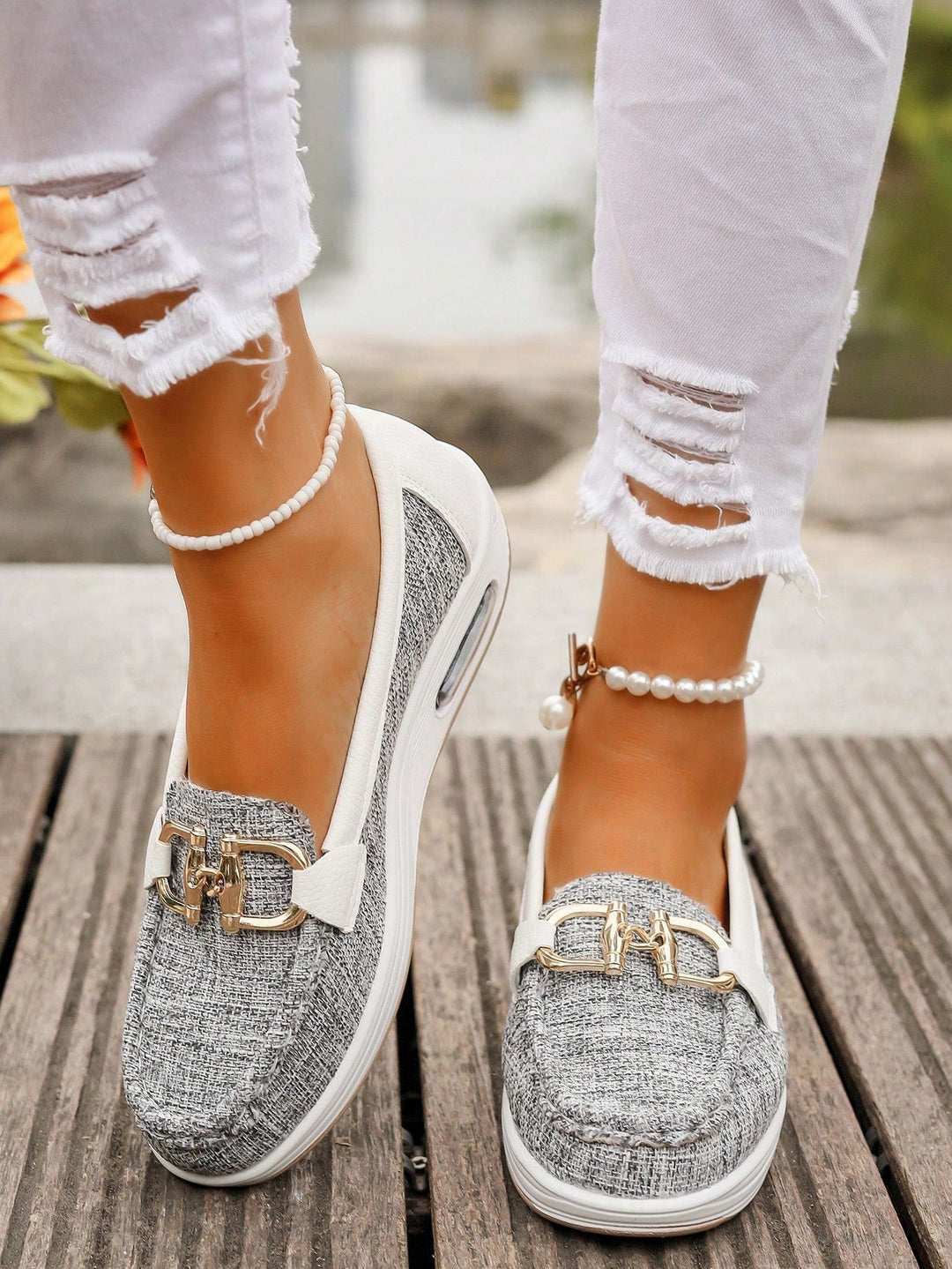 Refined women's gold buckle loafers. Comfortable, stylish everyday footwear with a classic design.