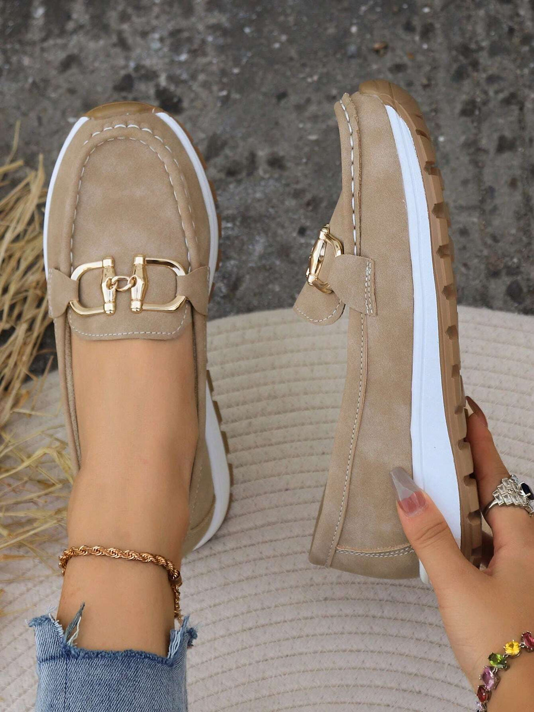Elegant women's gold buckle loafers. Slip-on comfort shoes, perfect for versatile everyday styling.