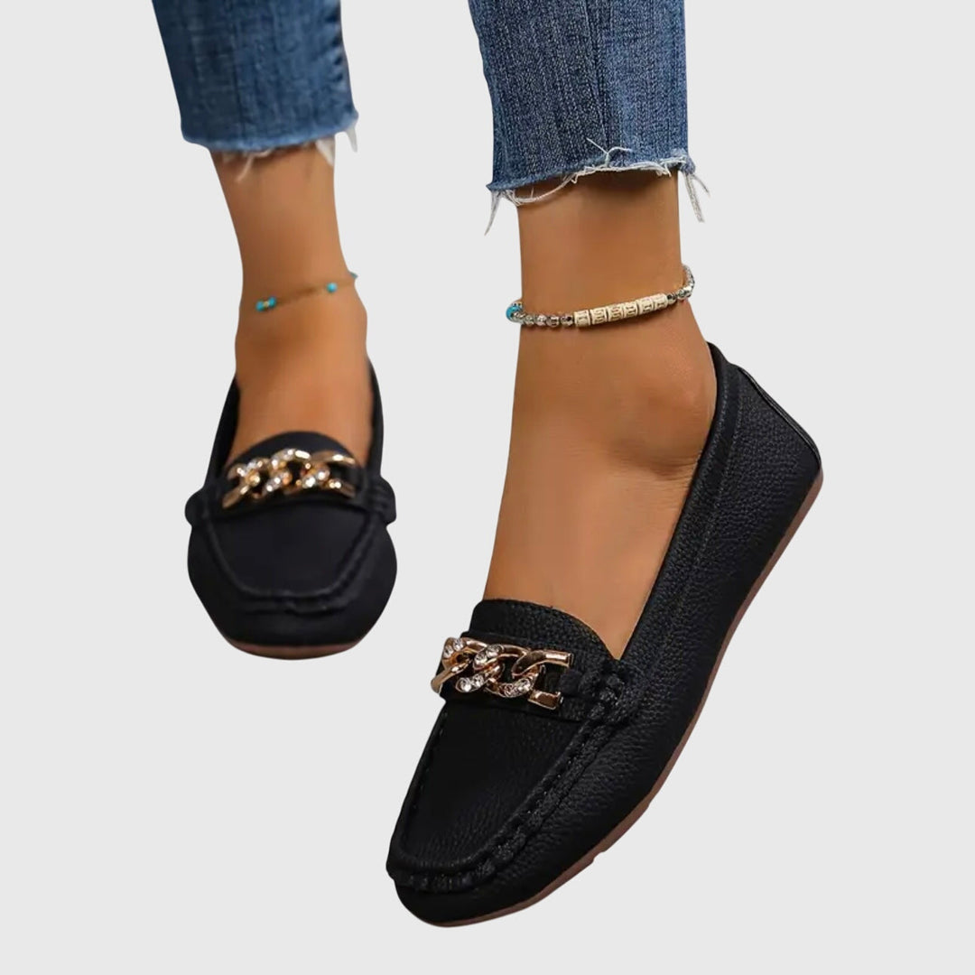 Elegant women's wedge loafers with gold chain detail, perfect for chic versatile style.