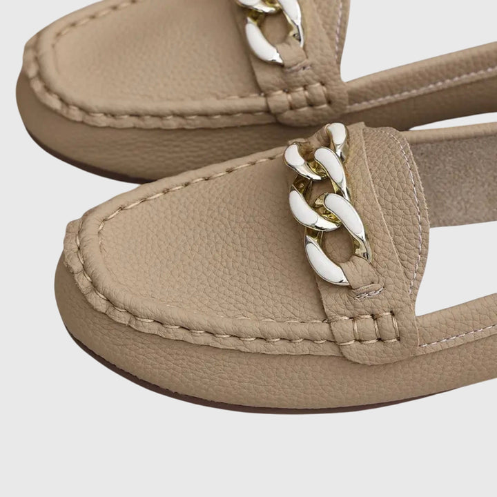 Classic women's gold-chain wedge loafers, offering an elegant look and all-day comfort.