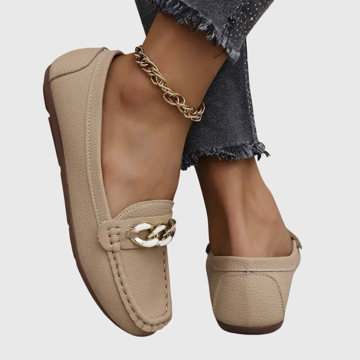 Gold-chain embellished women's wedge loafers, providing comfort & sophisticated style.