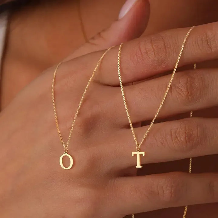 Stylish women's gold plated pendant with a single initial, delicate design