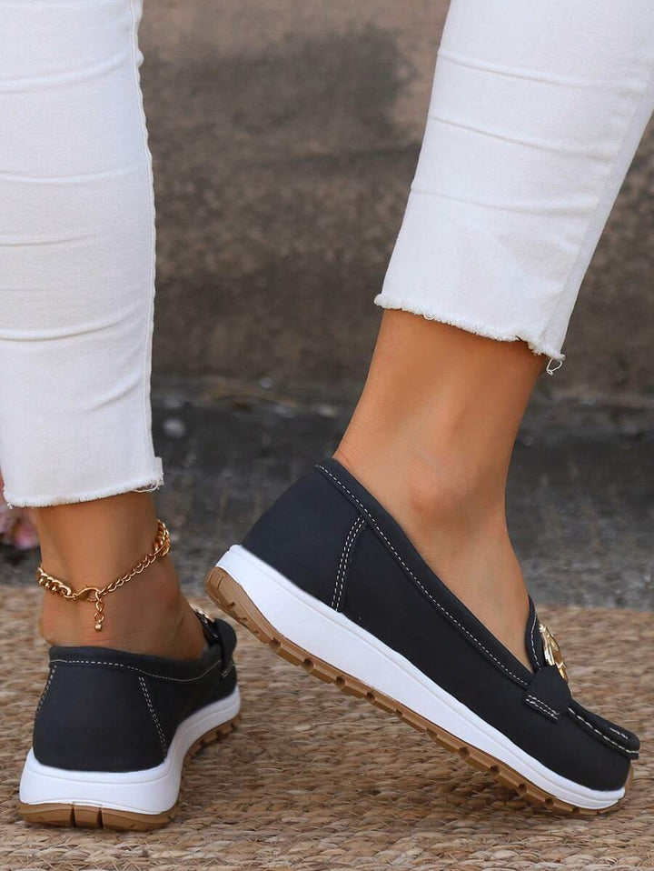 Stylish women's horsebit loafers with gold accent, ideal comfortable footwear for professional attire.
